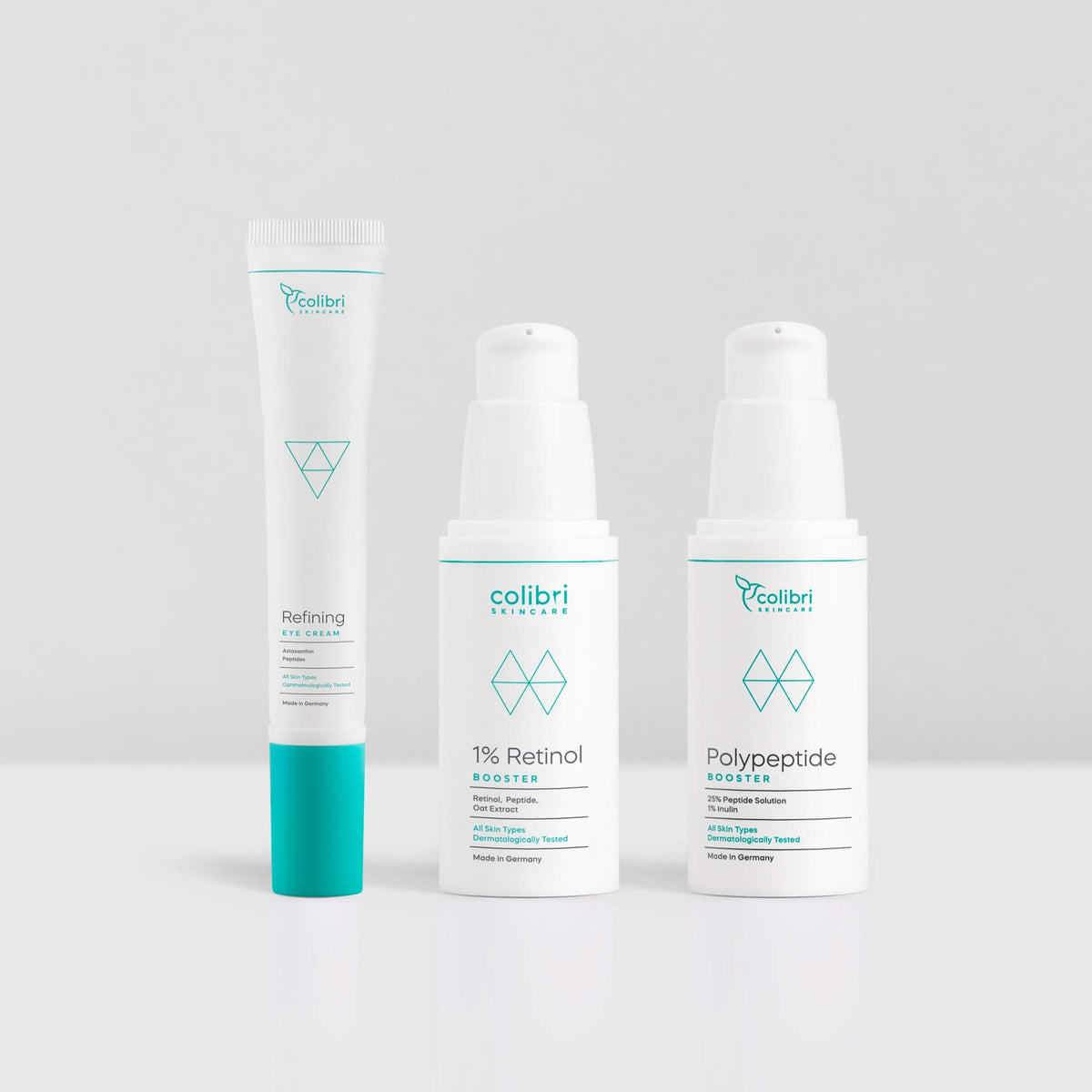 Drei Hautpflegeprodukte von Colibri Skincare auf weißem Hintergrund: Augencreme, Retinol-Booster, Polypeptid-Booster.